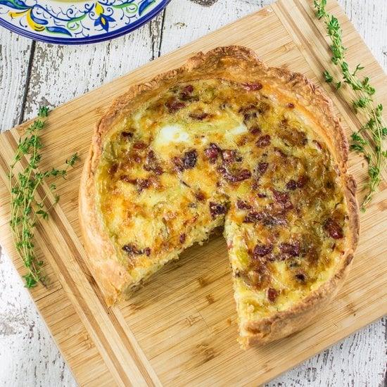 Leek and Gruyere Quiche on a rustic wooden table
