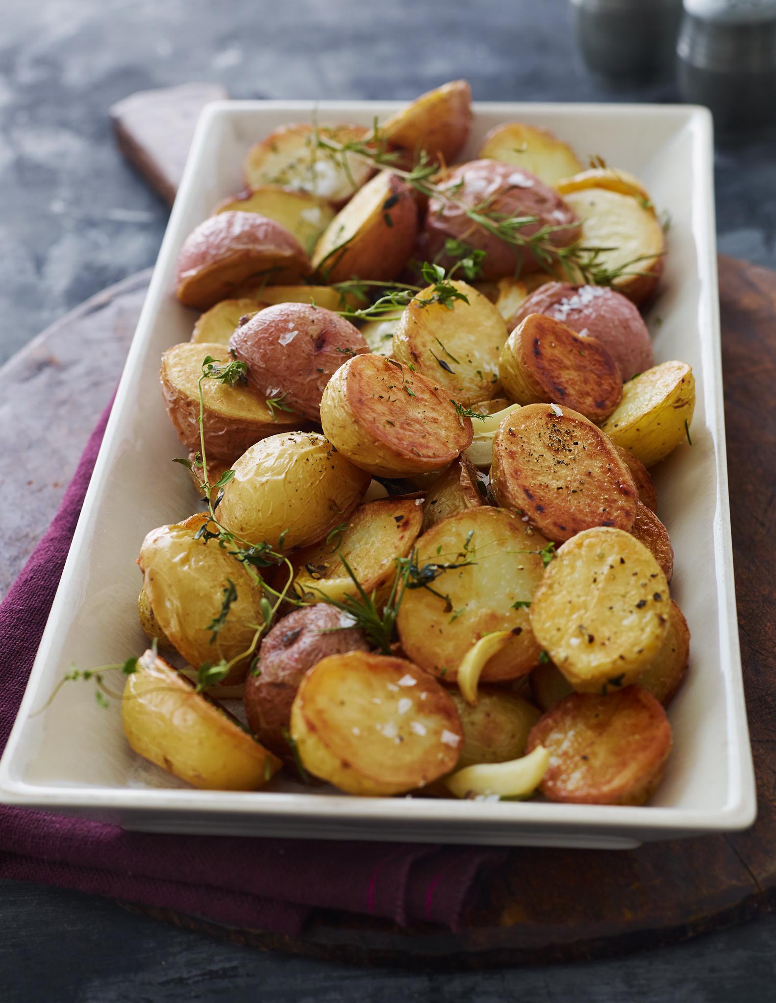 oven with roasted potatoes inside