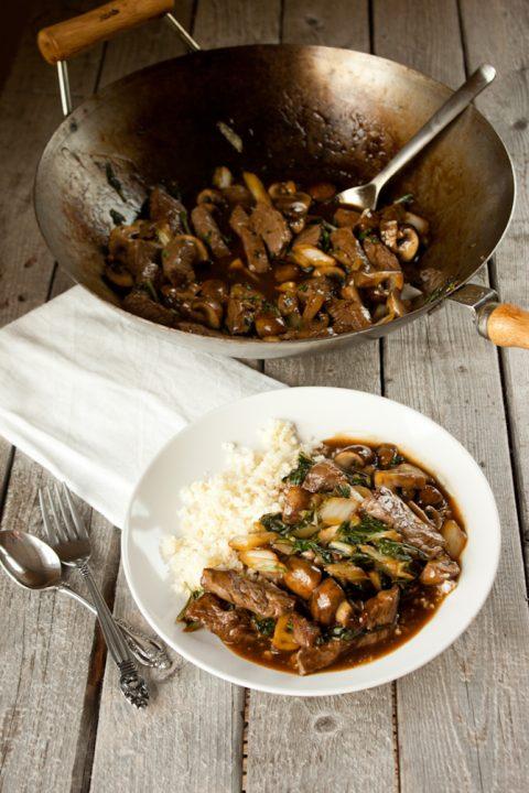 A sizzling beef and bok choy stir-fry in a wok