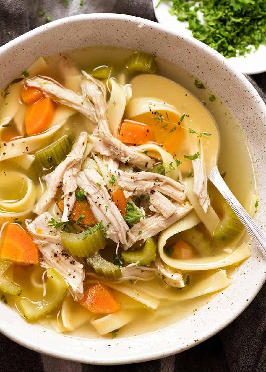 Steaming bowl of homemade chicken noodle soup