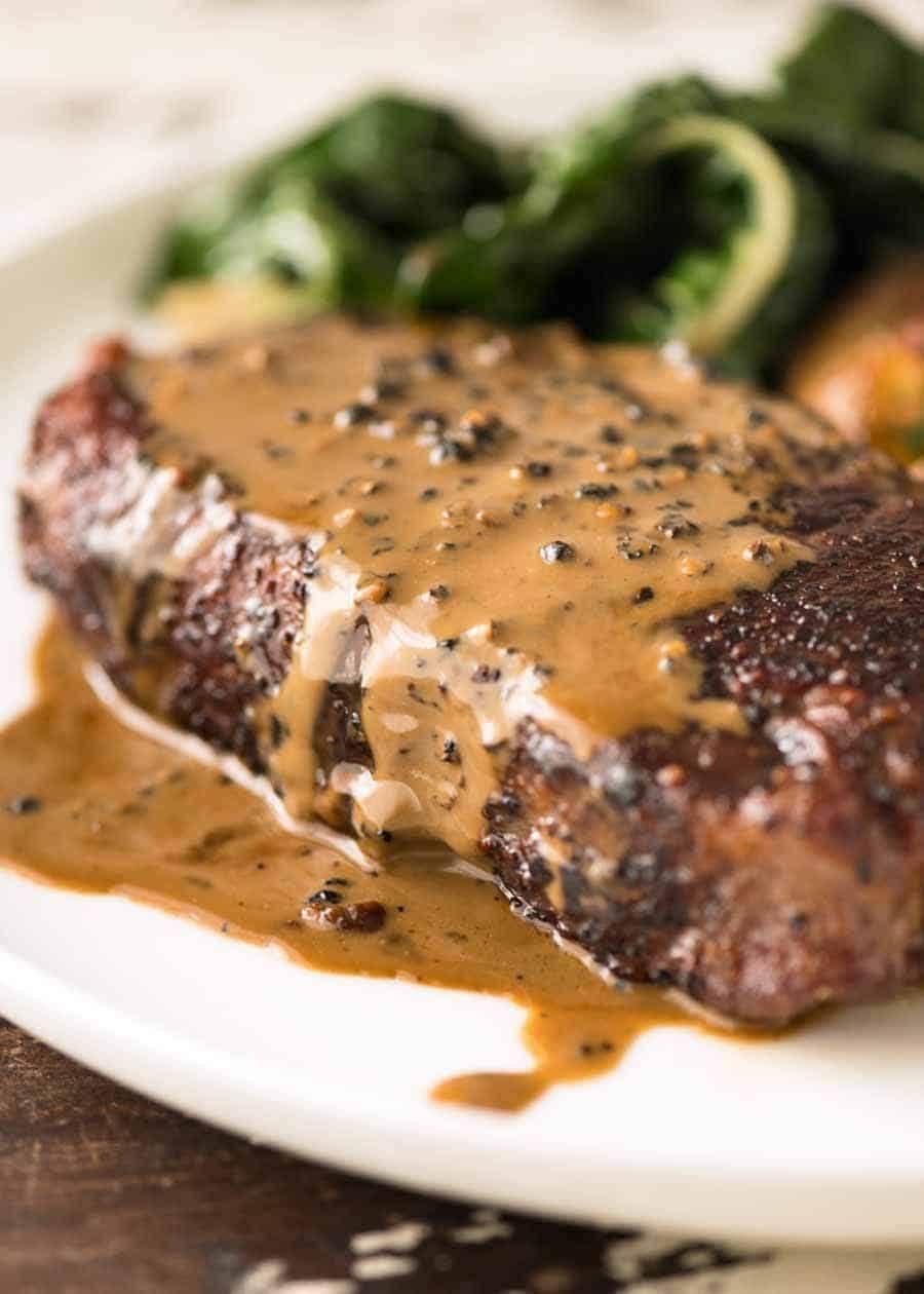 Juicy steak with rich peppercorn sauce
