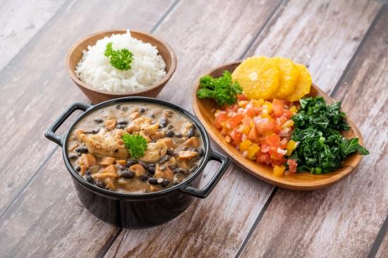 bowl of feijoada with chicken and rice