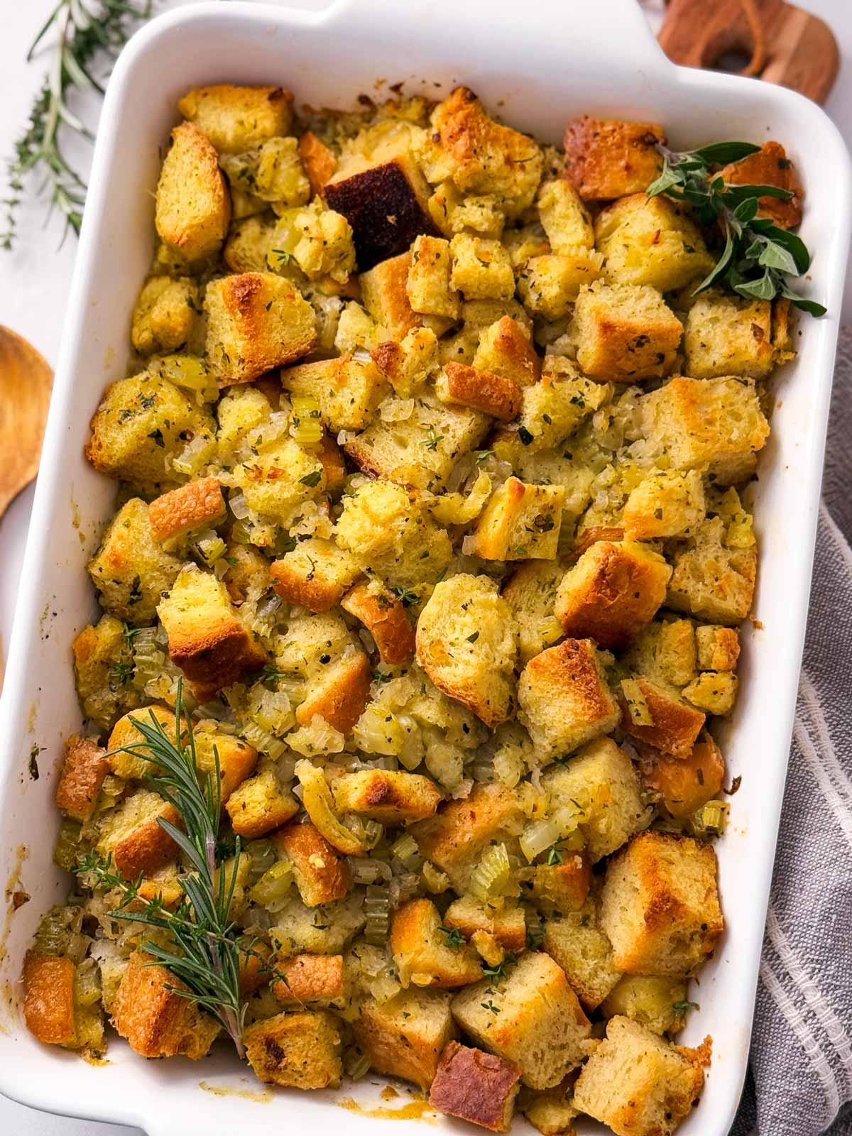savory stuffing baking in an oven, golden and bubbling
