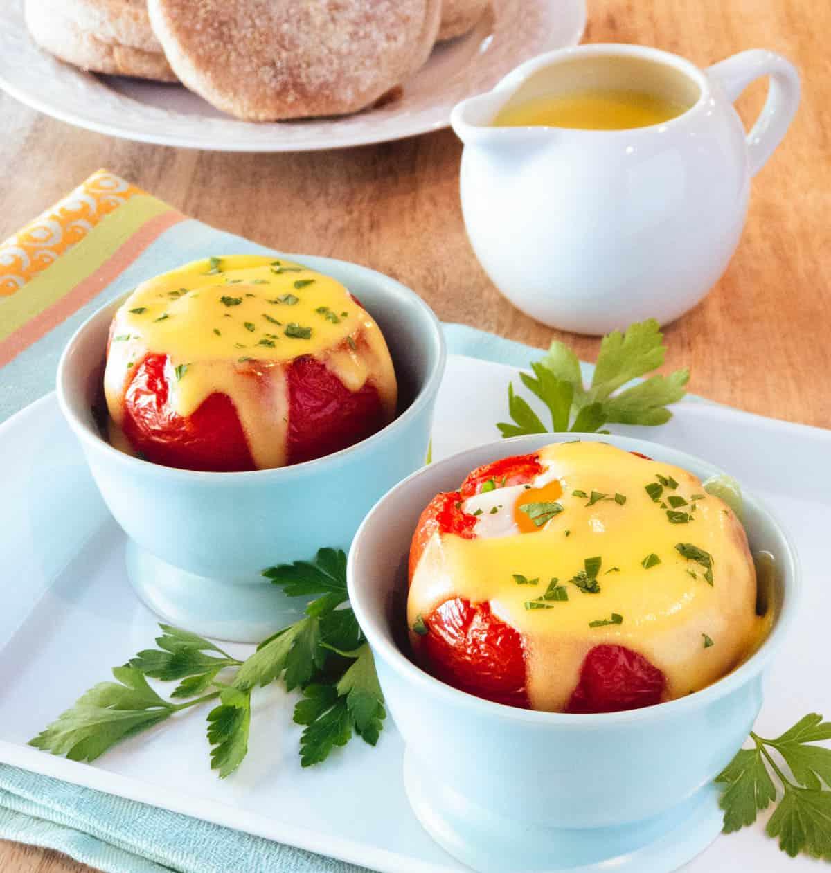 Close-up of Eggs Benedict with tomato showing layers of ingredients