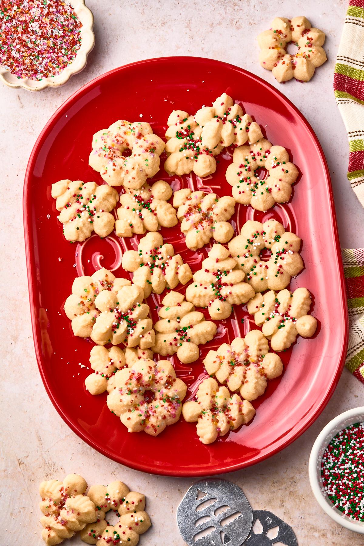 Decorated spritz cookies arranged artfully on a festive platter
