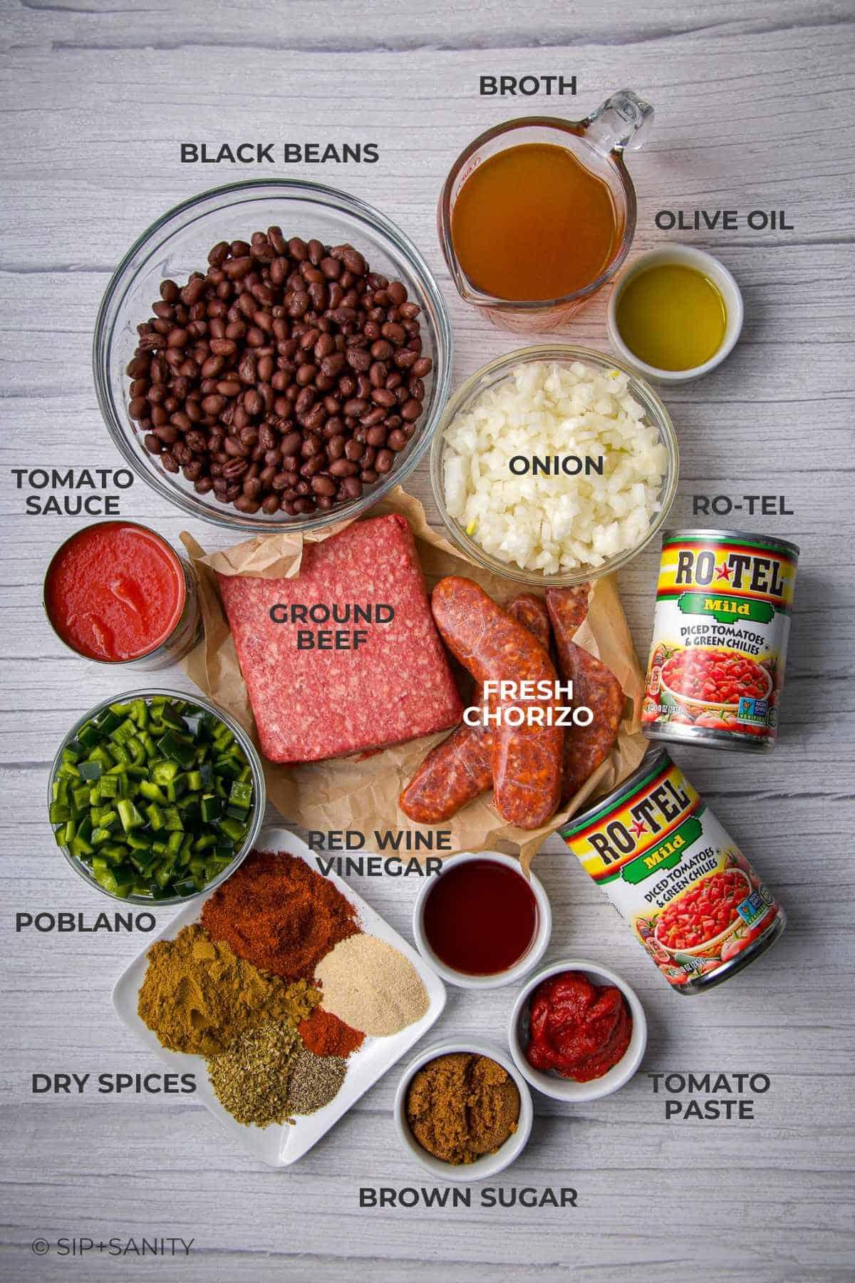 ingredients for chorizo corn chili laid out on a wooden surface