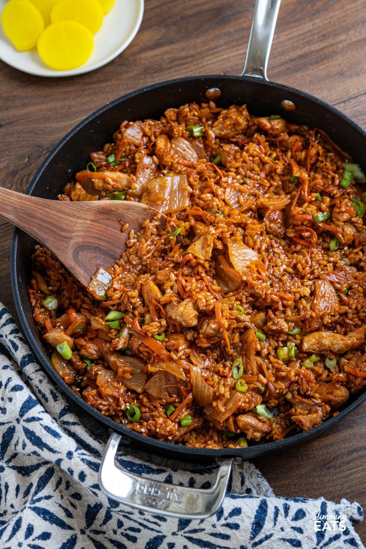 large skillet with rice, chicken, and kimchi