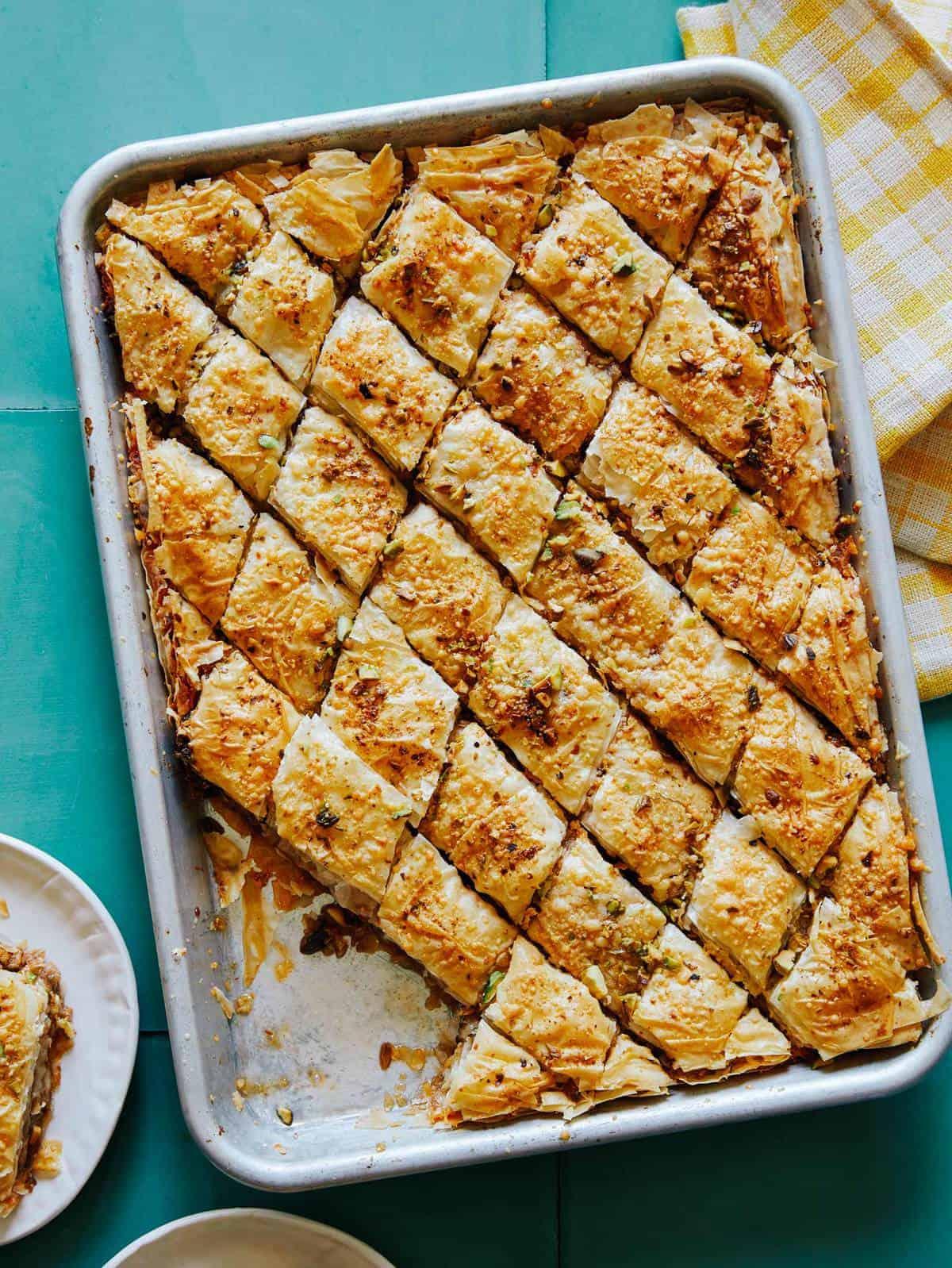 Baklava spiced lamb being shredded with forks