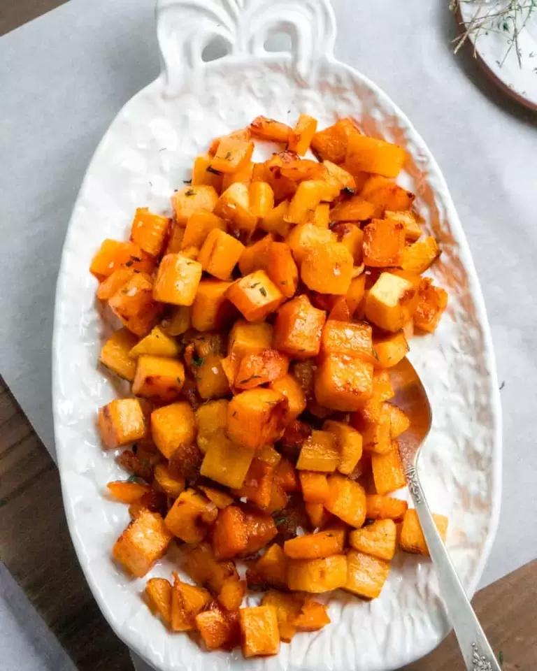 Beautifully plated maple roasted butternut squash with a glistening caramel glaze