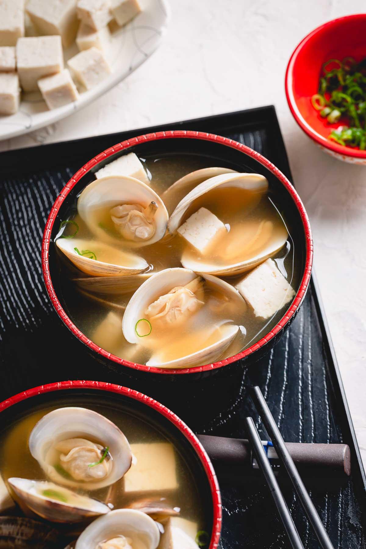 close up of a bowl of miso soup with sea anemone
