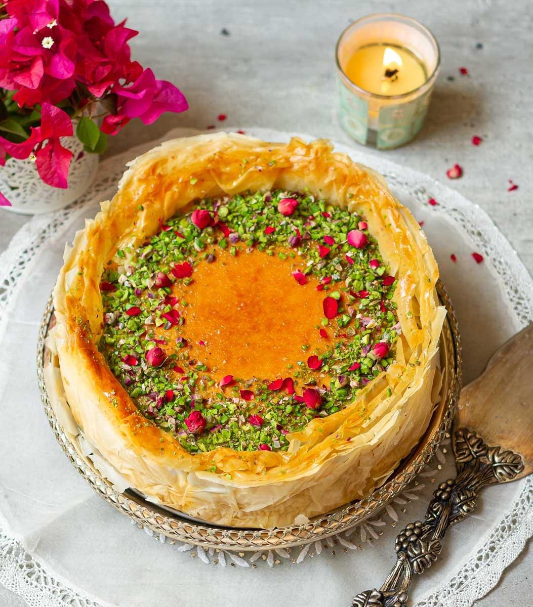 Ingredients for baklava cheesecake neatly arranged on a countertop