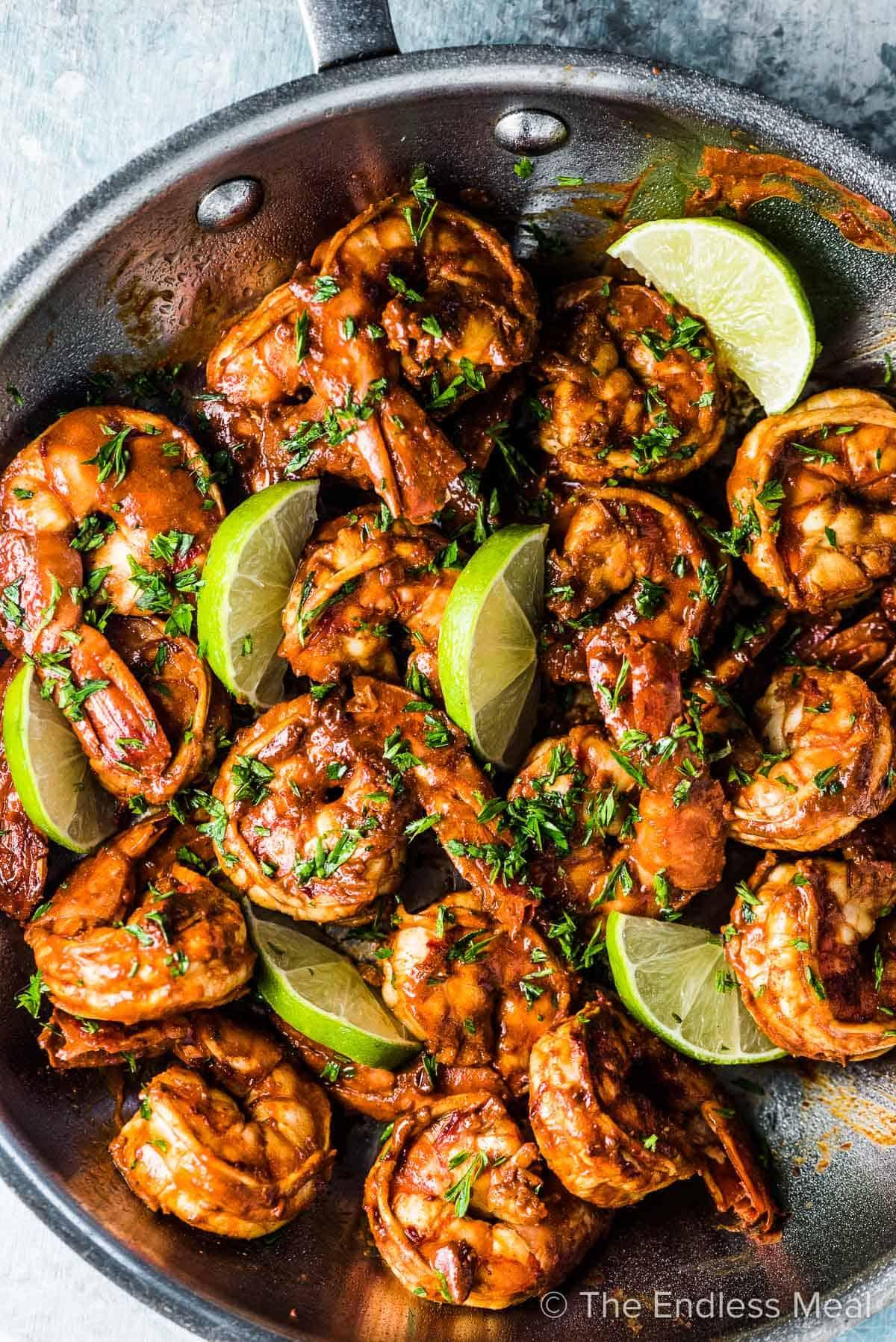 ingredients for chili lime shrimp stir-fry laid out on a wooden table