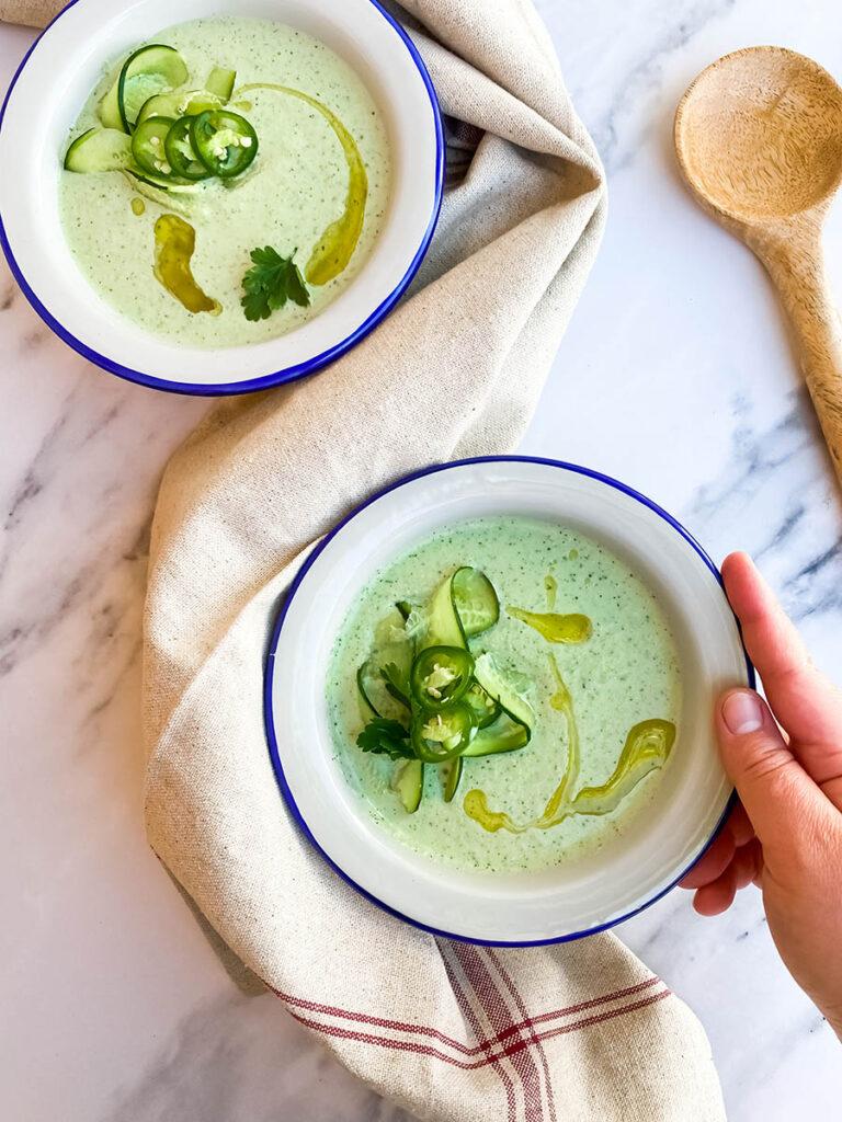 chilled cucumber and greek yogurt gazpacho being served outdoors
