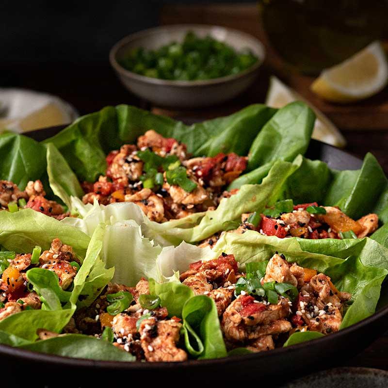 lemon thyme chicken lettuce wraps being assembled