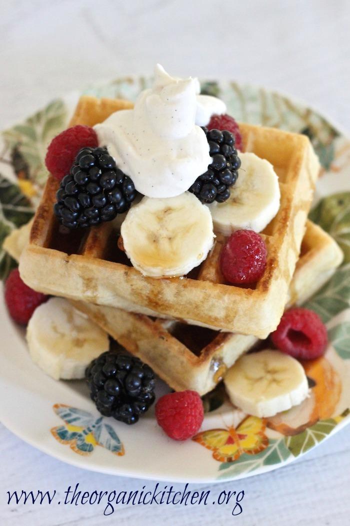 delicious easter brunch waffles with fresh berries and whipped cream