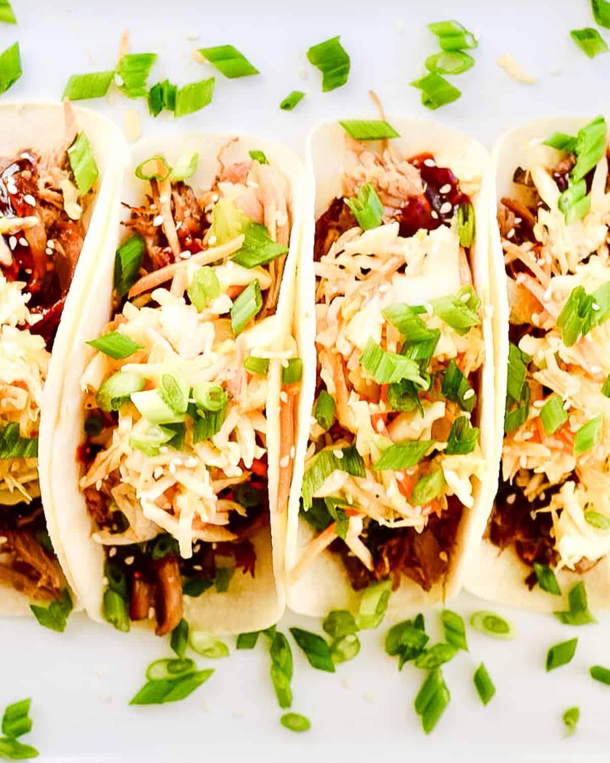 Overhead shot of several kimchi waffle tacos on a plate