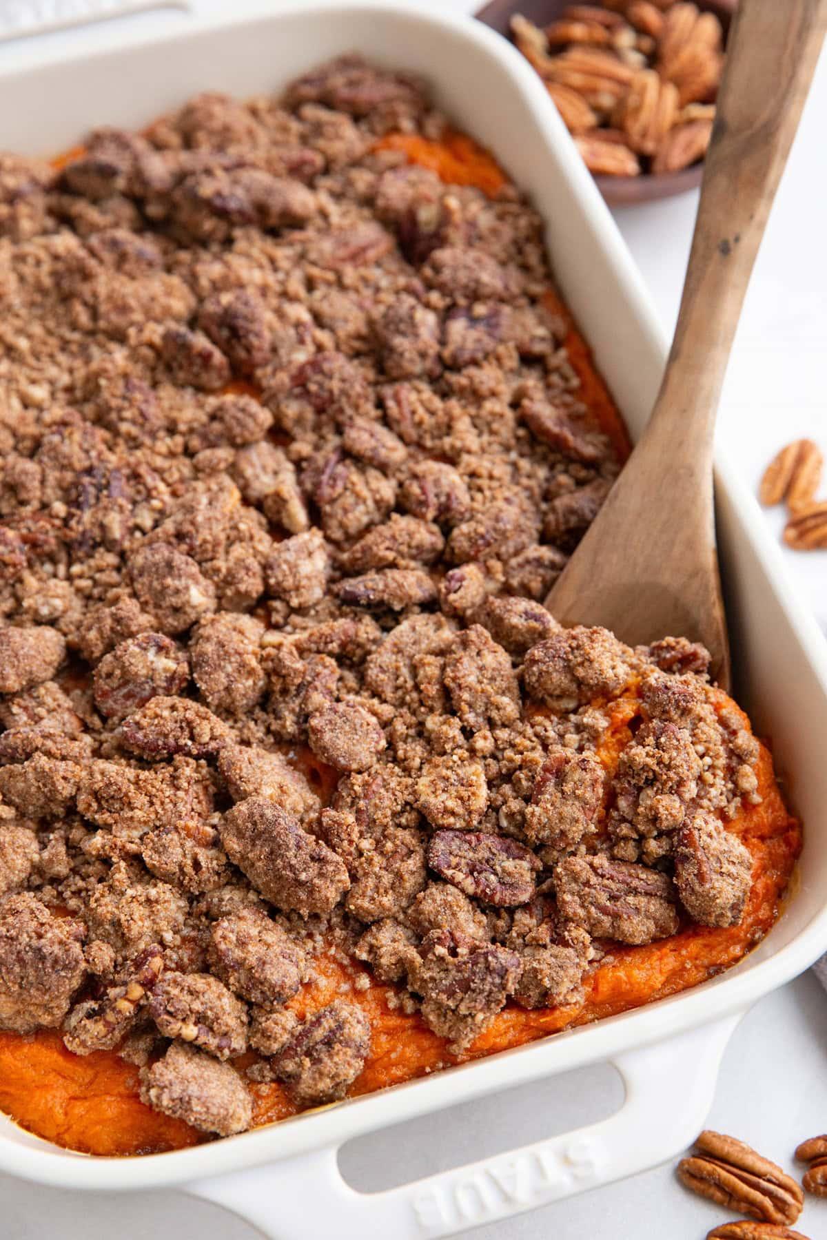 Sweet potato casserole ready to bake, with uncooked streusel topping.