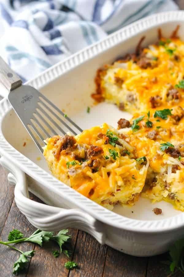 Close-up shot of breakfast sausage and hash brown casserole being baked in the oven