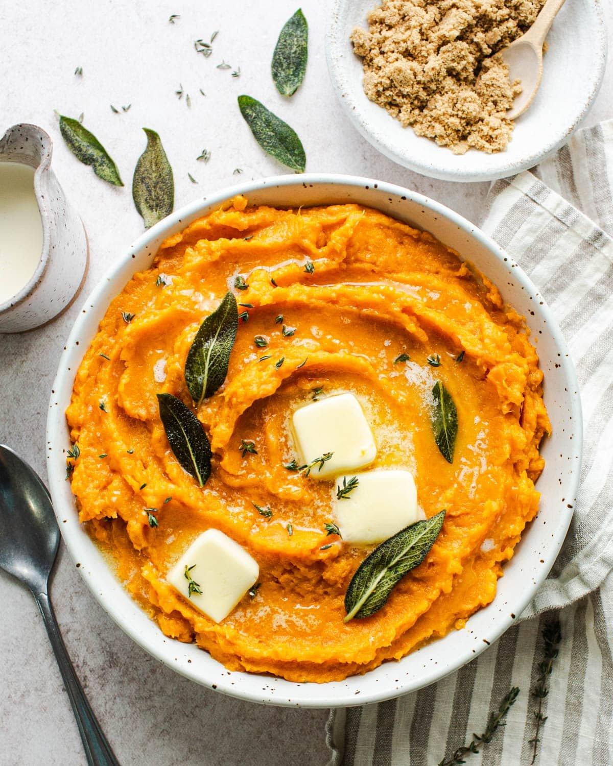creamy mashed sweet potatoes in a bowl with spices