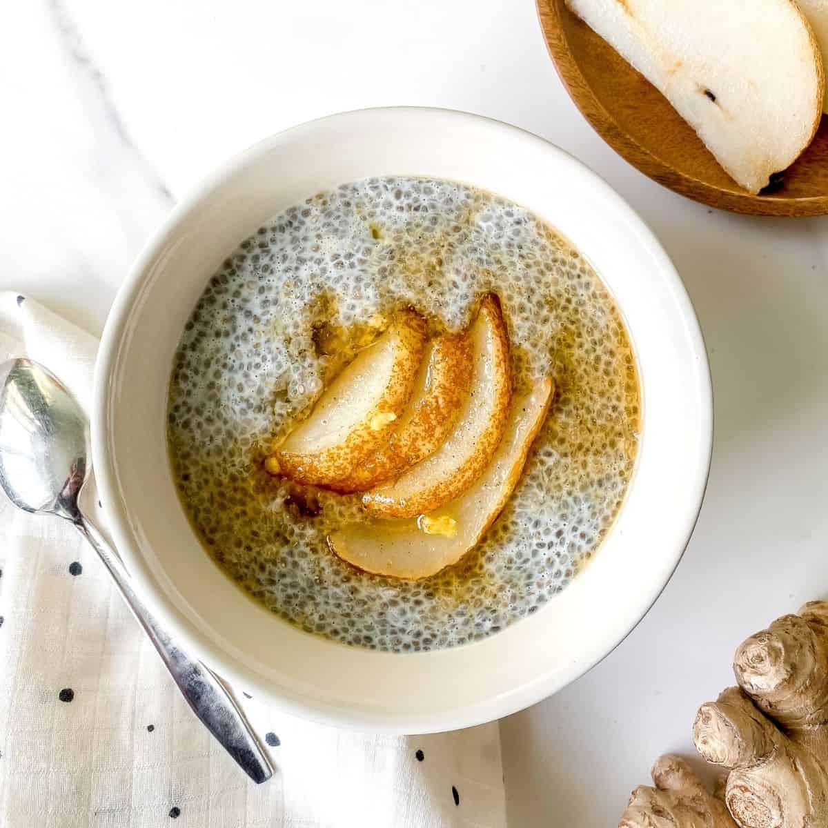 spiced pear and ginger chia pudding being assembled in a kitchen setting