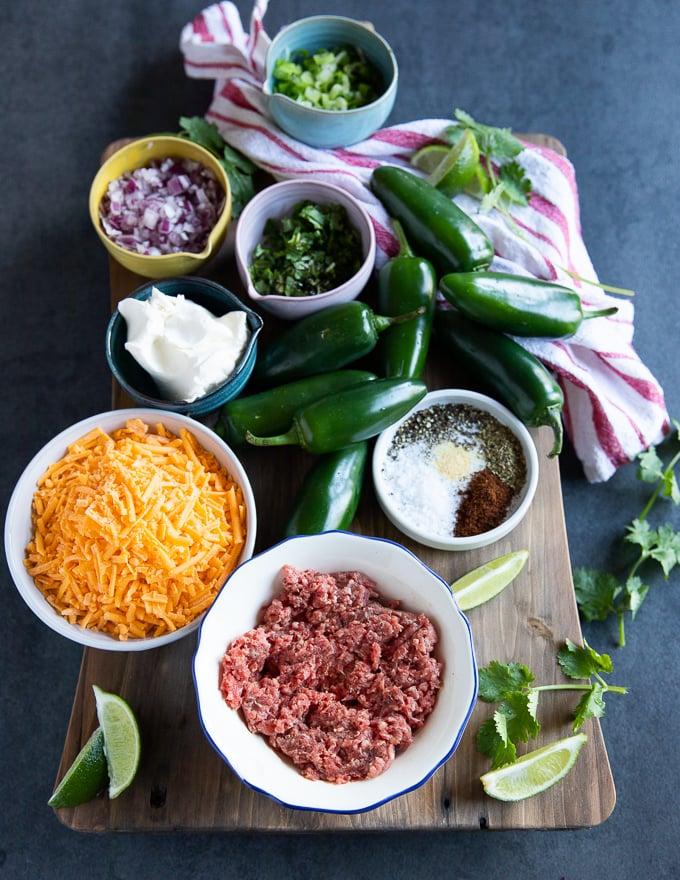 various toppings and ingredients for jalapeño popper falafel arranged on a table