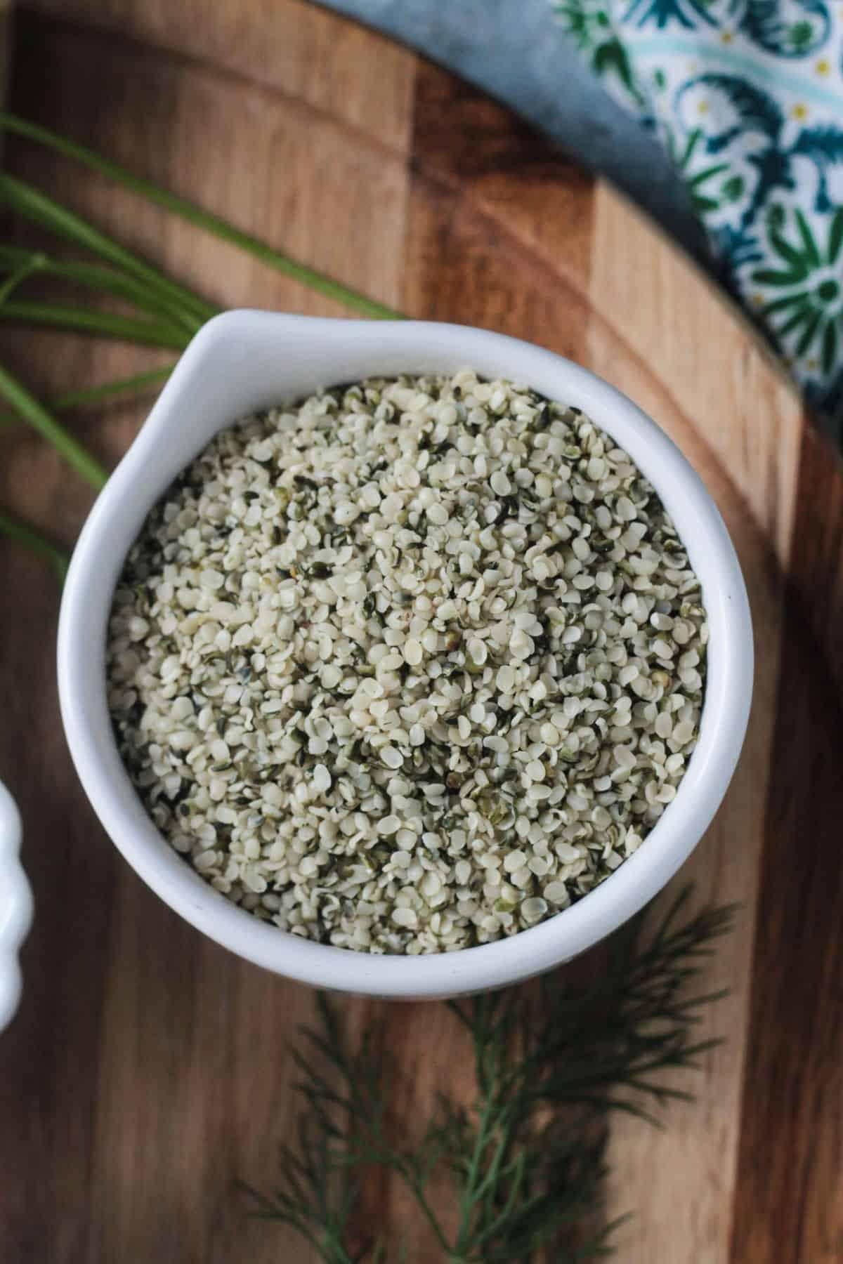 Close-up of hemp seeds being poured into a bowl