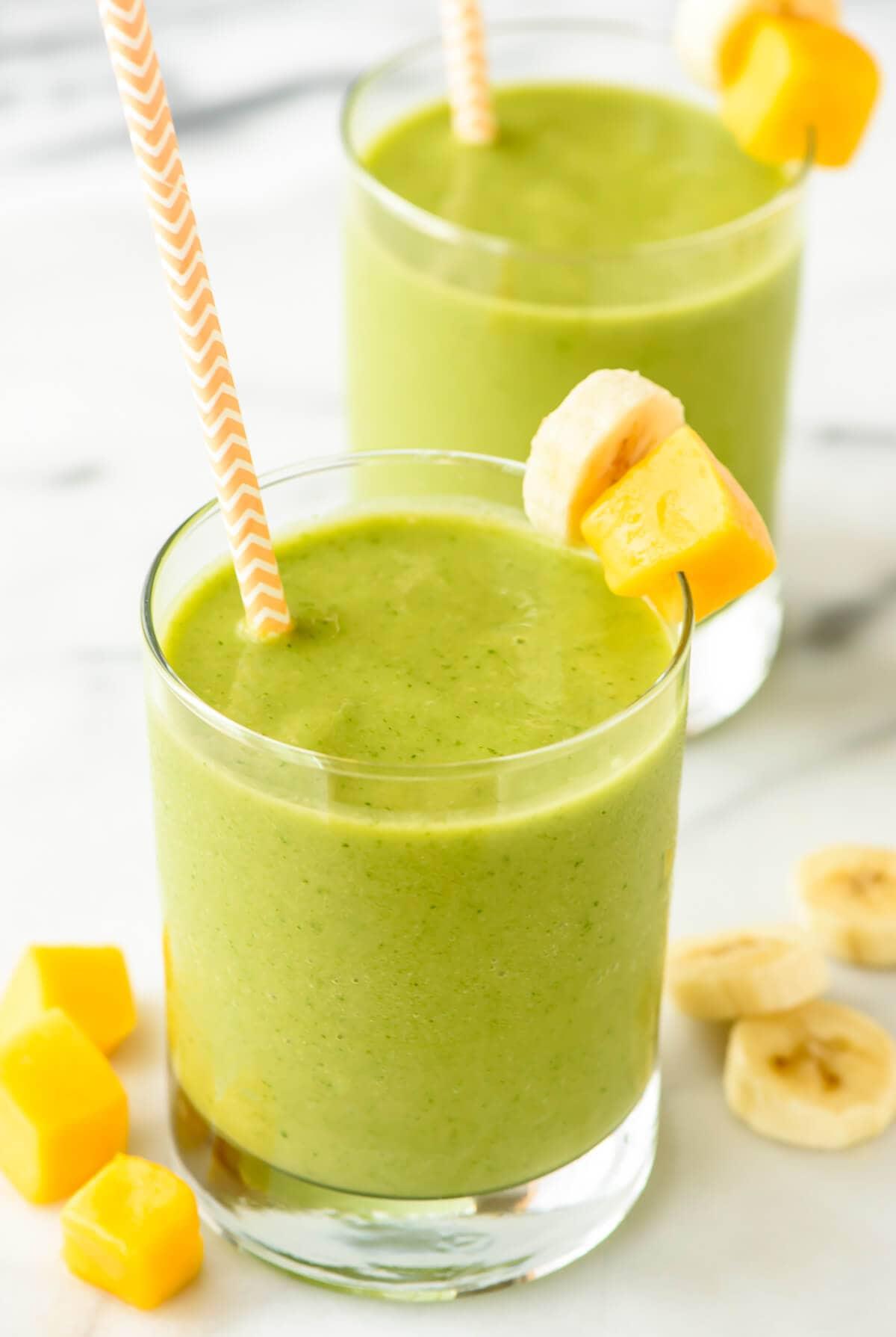 vibrant green smoothie with mango and spinach