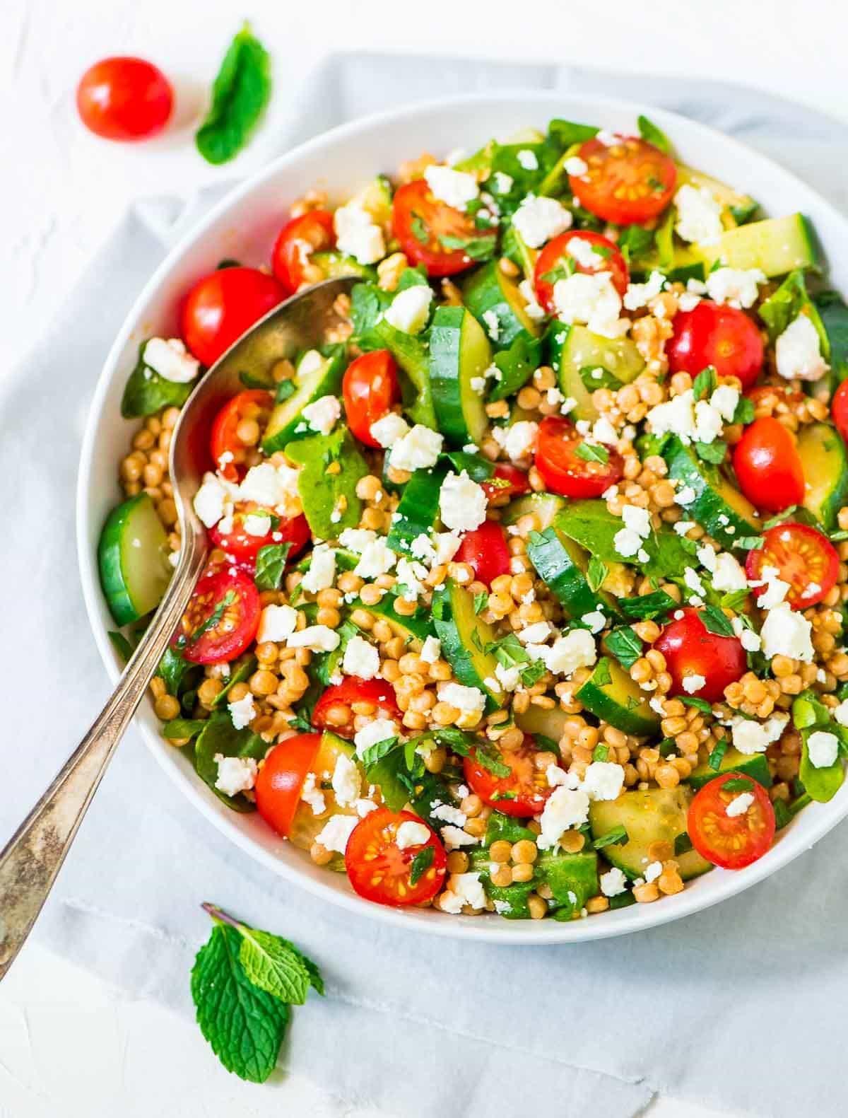 fresh pearl couscous pasta salad with vegetables and feta cheese