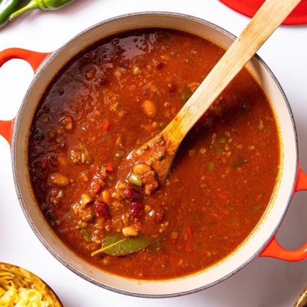 ingredients for slow cooker chili arranged on a wooden countertop