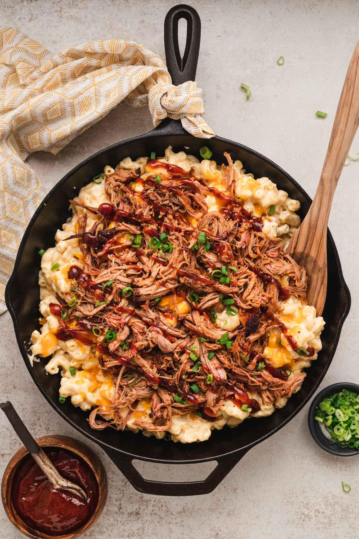 BBQ Pulled Pork Mac and Cheese in a cast iron skillet