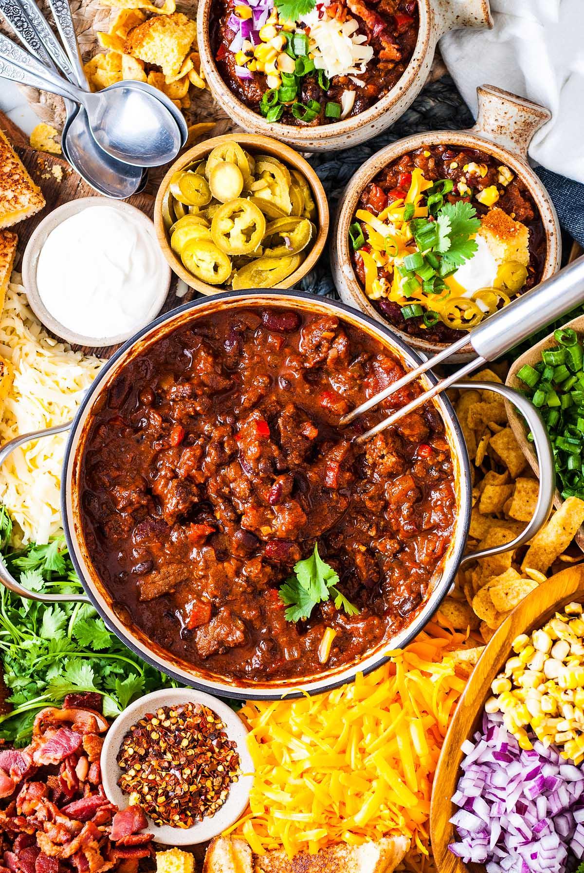 Family enjoying a Chili-Loaded Beef Skillet dinner around a kitchen table