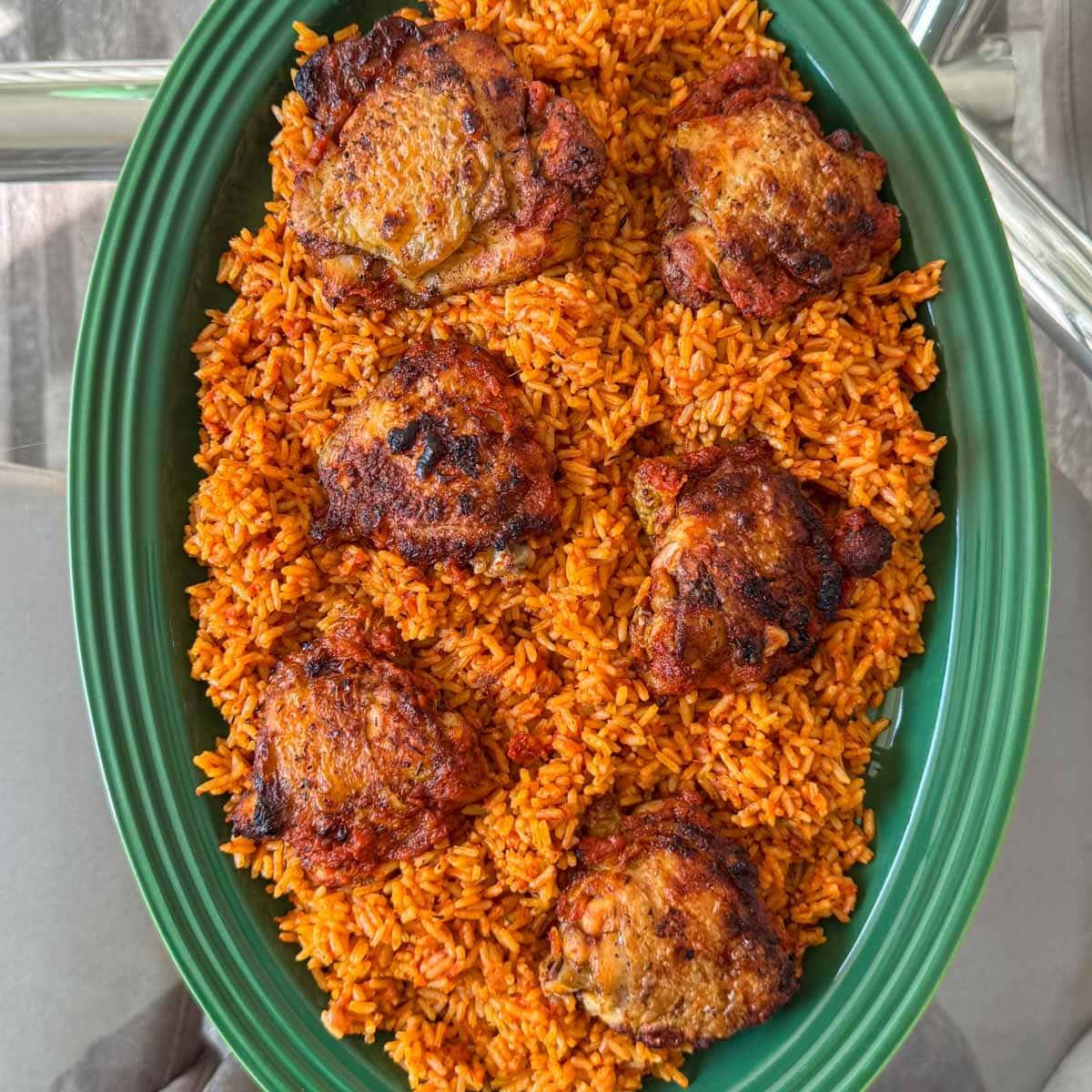 A vibrant pot of Jollof rice simmering on a stovetop
