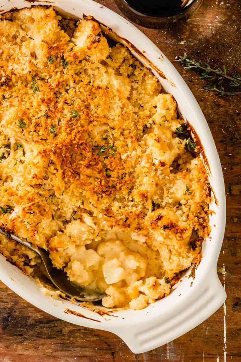 Overhead shot of a finished Callaloo Gratin with Gruyere Cheese, showing the golden-brown crust