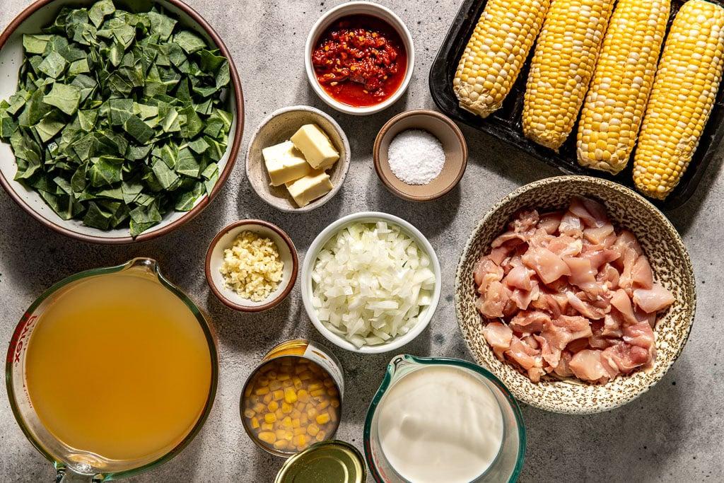 close-up of the ingredients for chicken corn chowder laid out on a countertop
