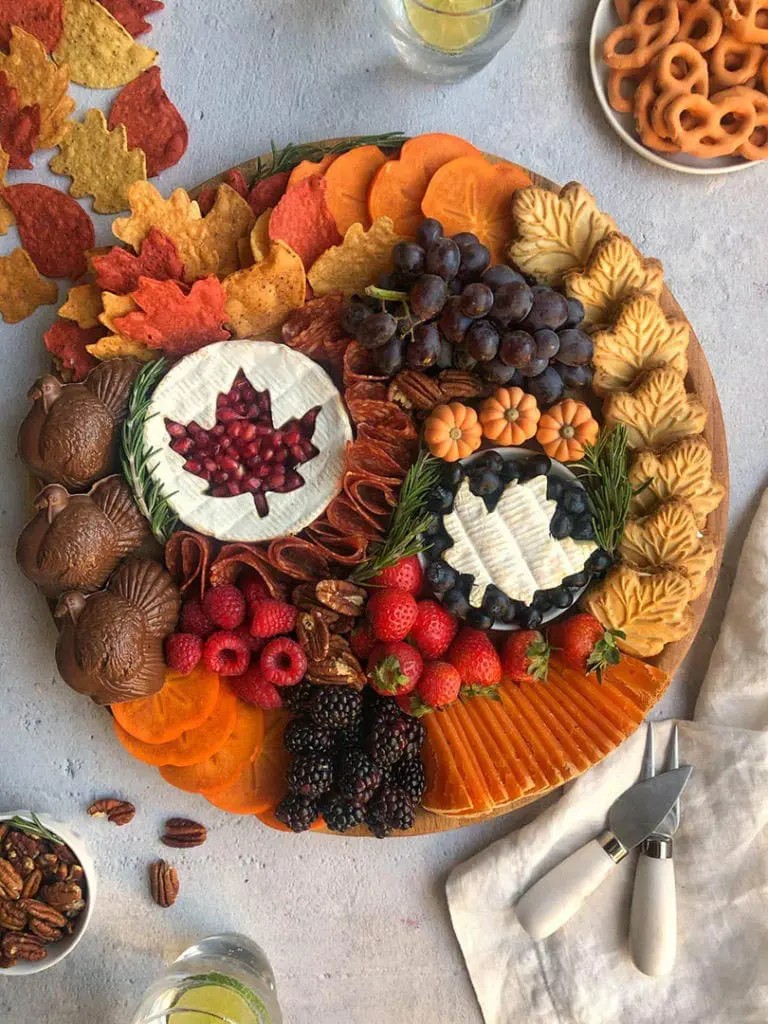 Thanksgiving Brie Honey Tart on a festive platter with autumn decor