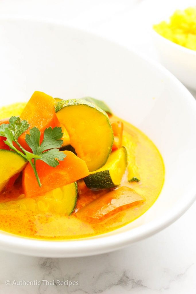 Vegan Thai Panang Curry with Cashews in a bowl garnished with fresh cilantro and lime wedges