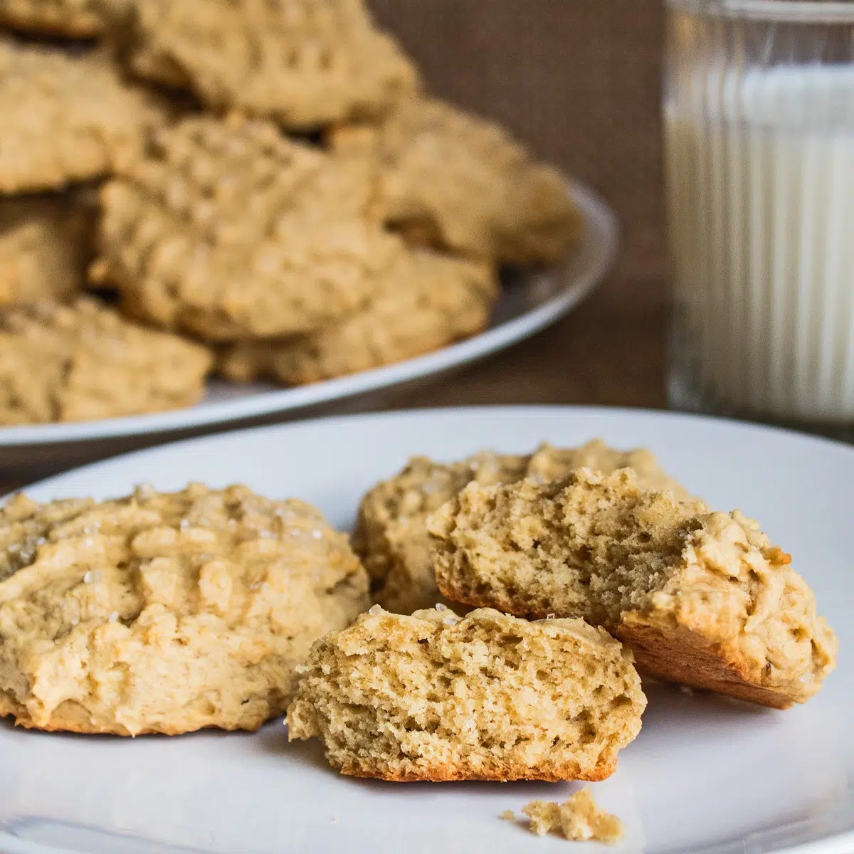 Close-up shot of a rustic-looking baking sheet with a selection of delicious homemade peanut butter and banana cookies.