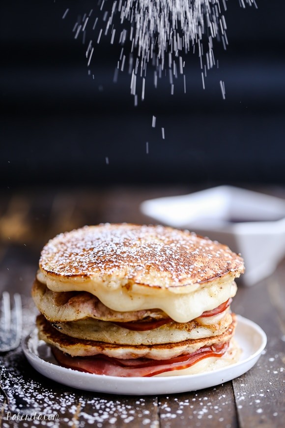 Monte Cristo Pancakes with powdered sugar and raspberry jam