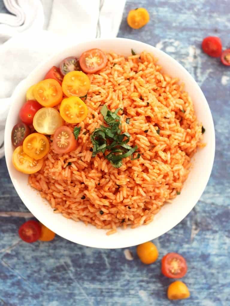 A bowl of perfectly steamed rice topped with a vibrant tomato salsa