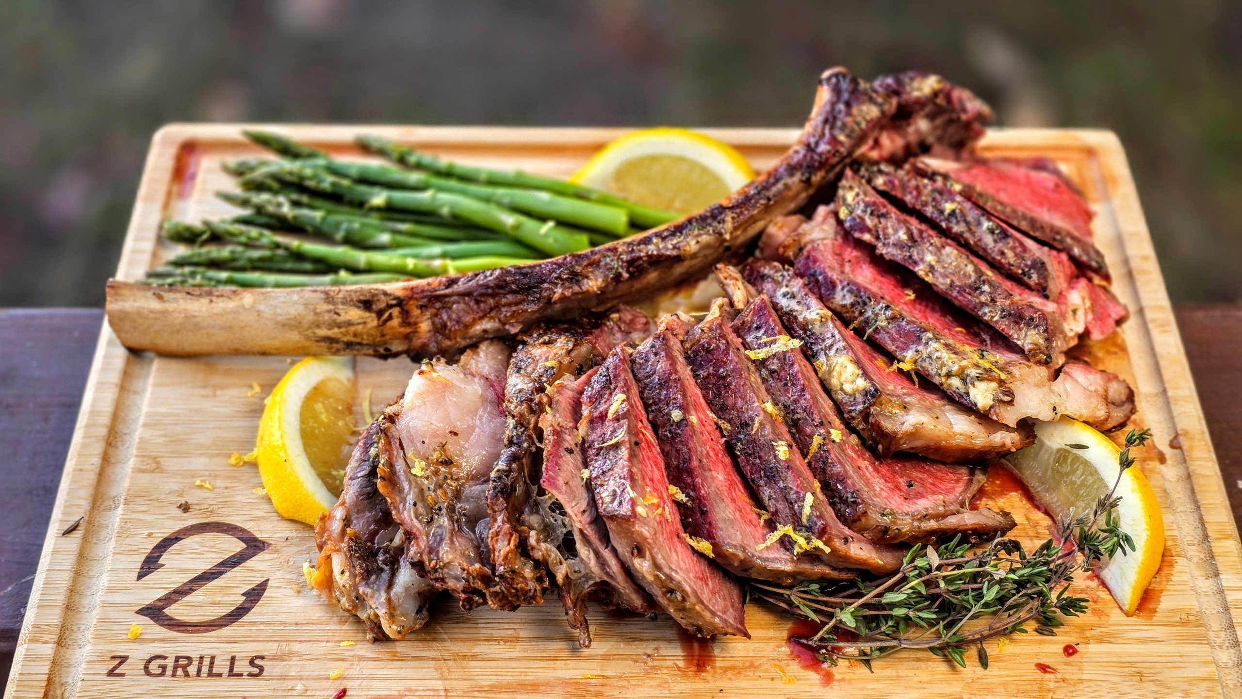 Juicy reverse seared tomahawk steak on a wooden board
