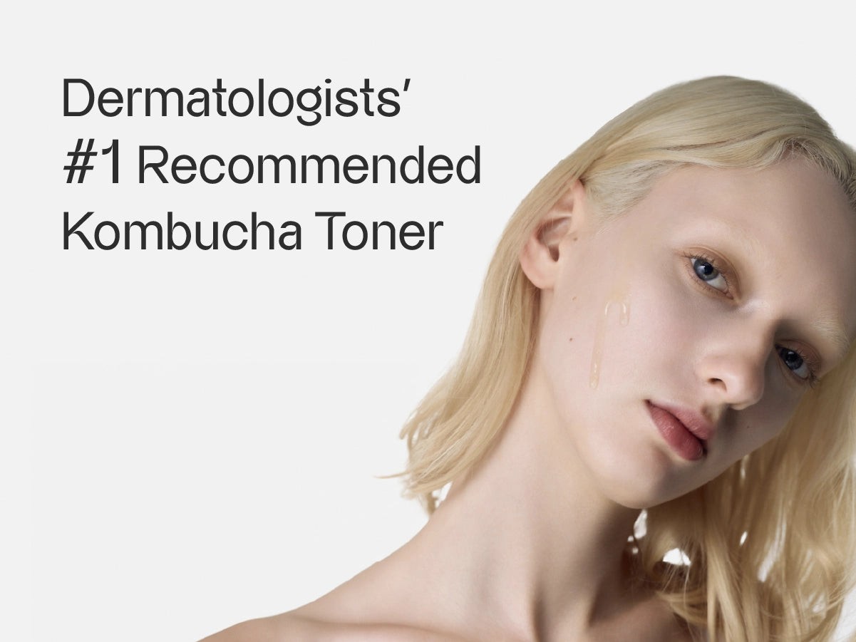 woman applying kombucha toner to her face in a bright, natural setting