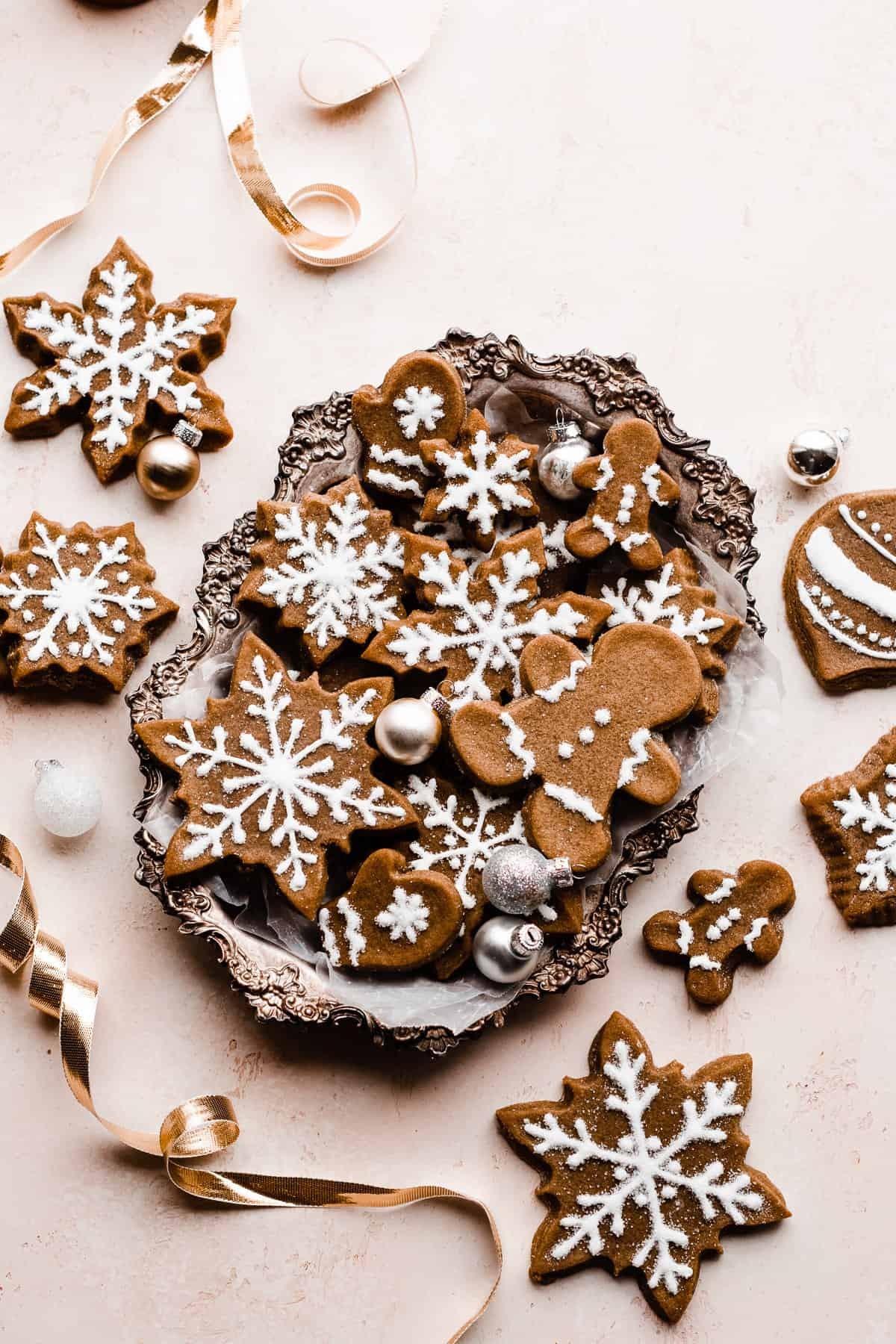 Molasses Midnight Gingerbread Men decorated with dark icing and edible glitter