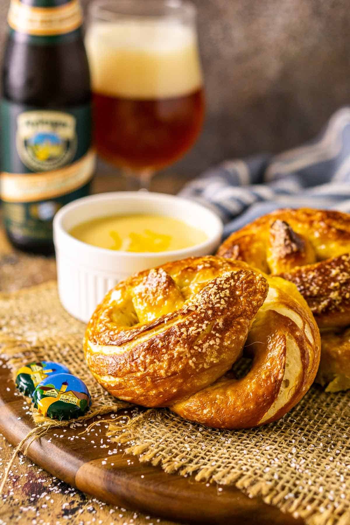 Close-up shot of crispy beer pretzels sprinkled with fresh rosemary