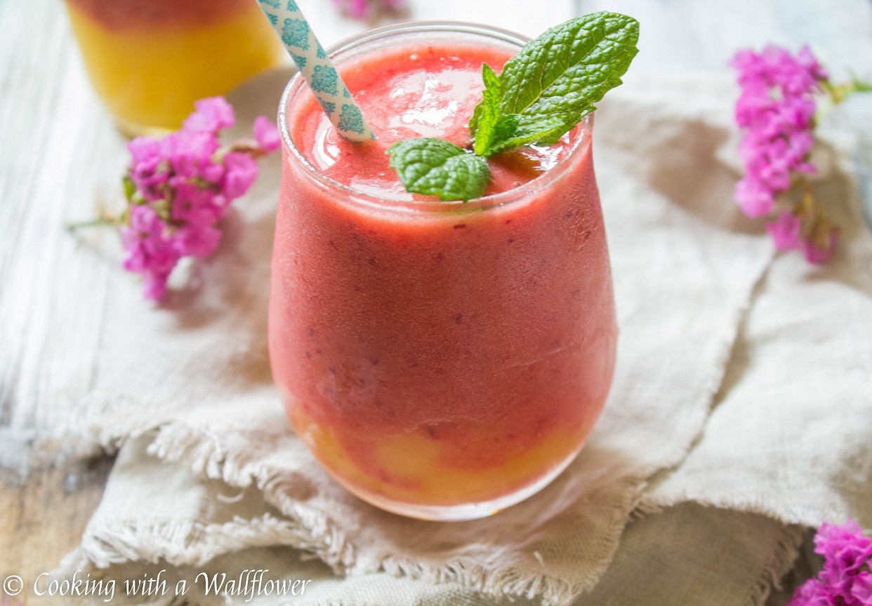 vibrant salmonberry peach smoothie in a glass