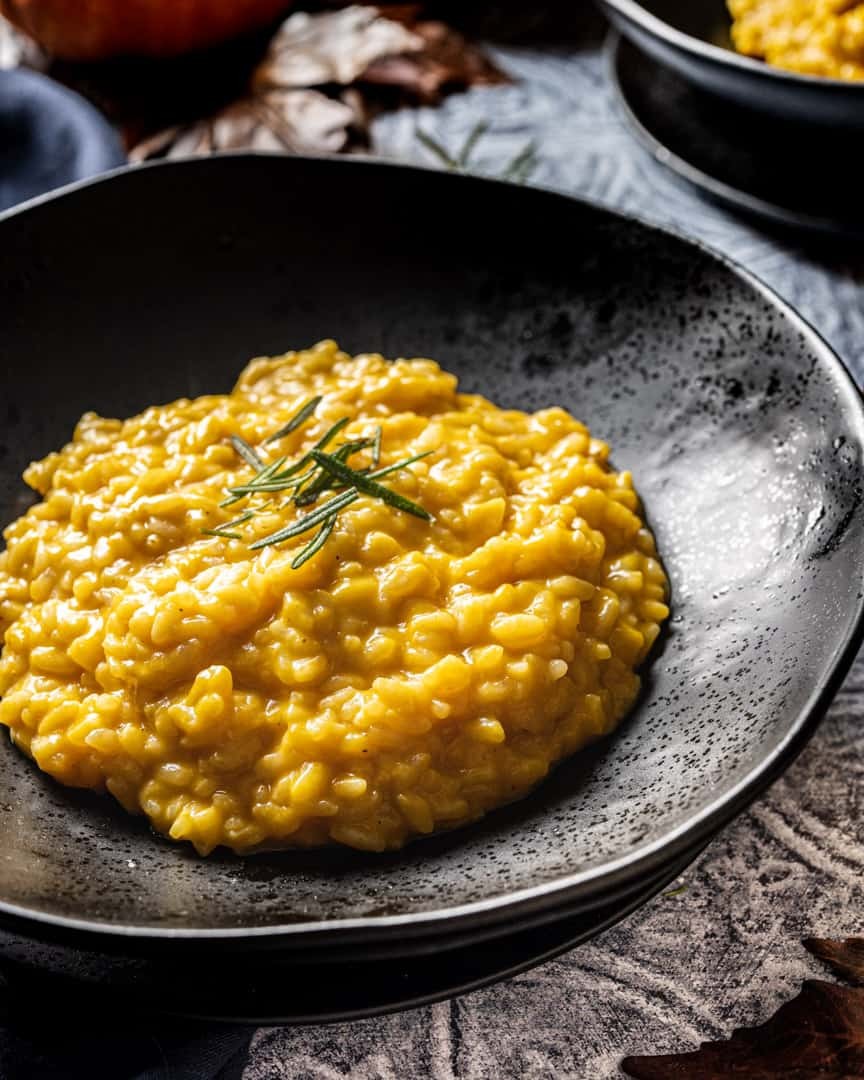 smoked pumpkin risotto with fontina cheese served in a bowl