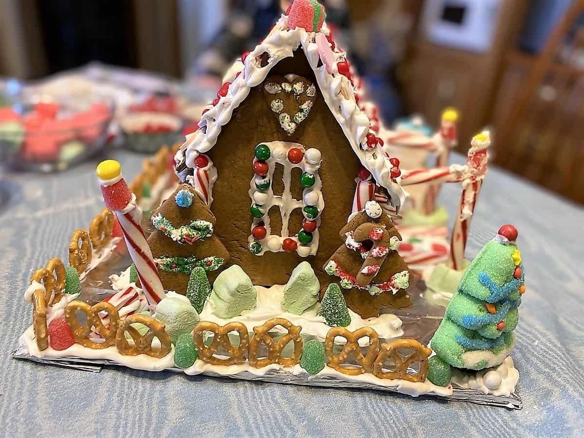 beautifully decorated soft gingerbread house with candy and royal icing