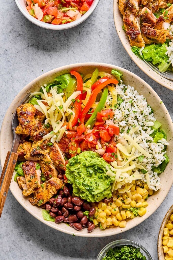 overhead shot of colorful chicken taco bowls
