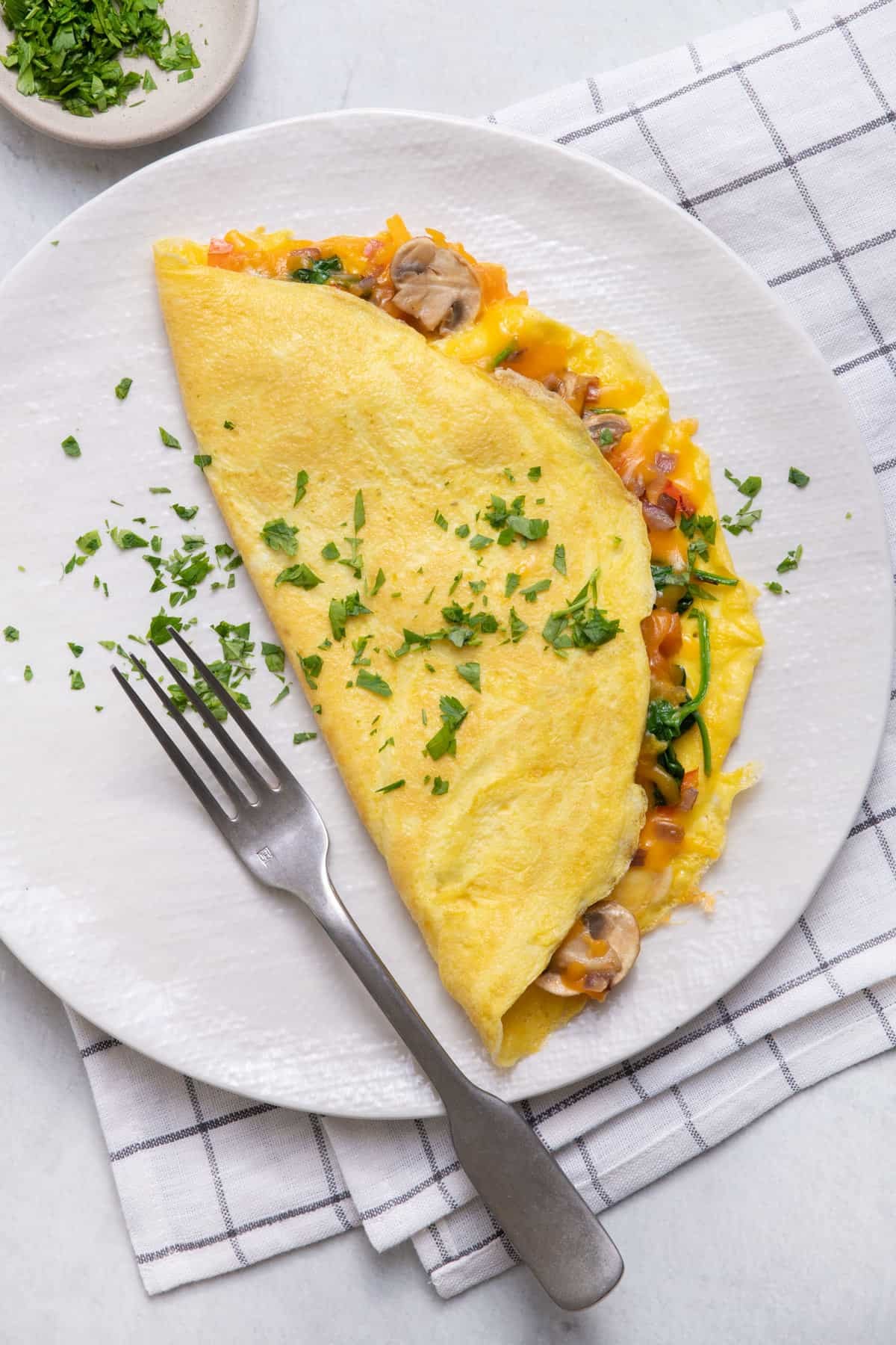A delicious roasted vegetable and cheese omelet on a plate