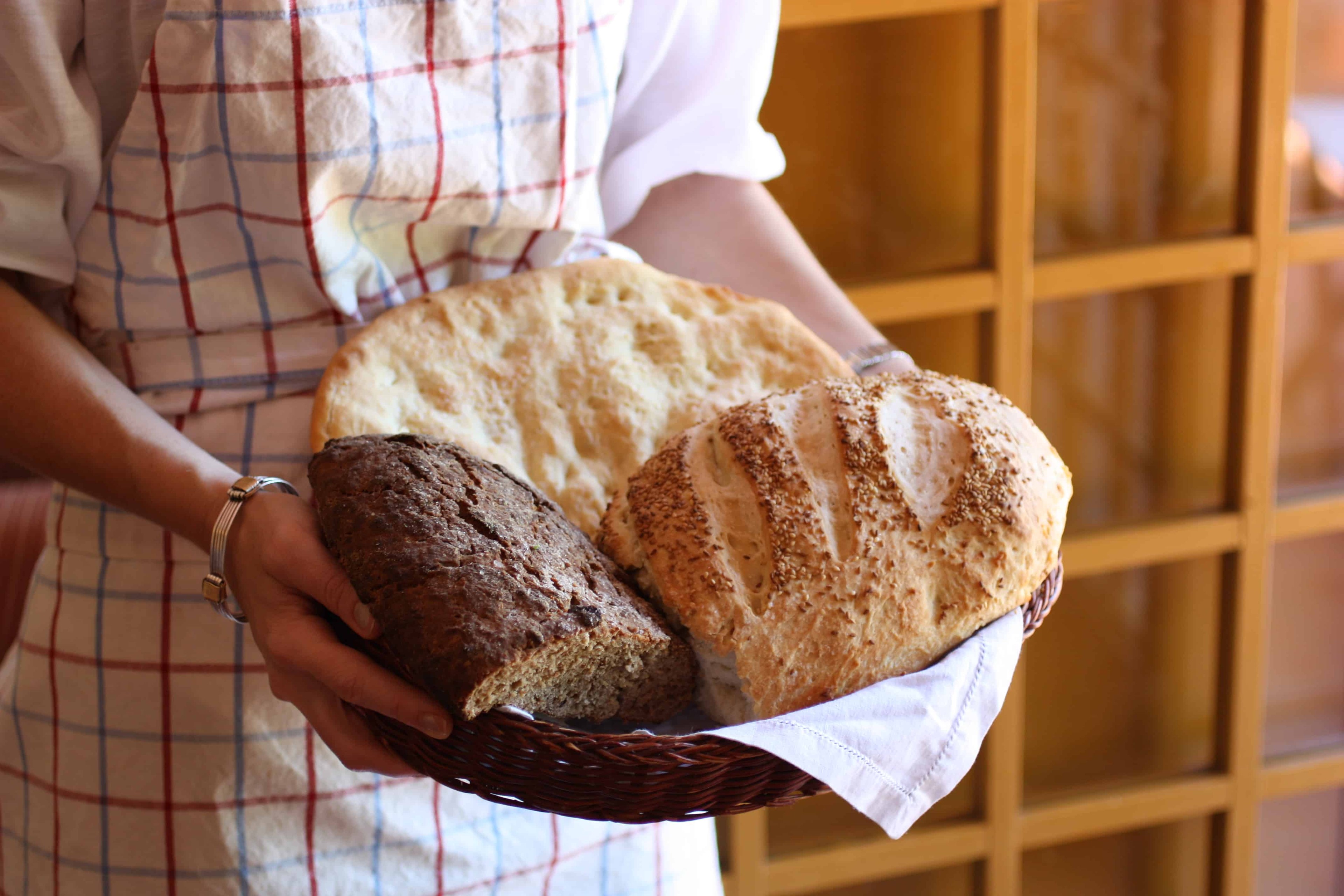 golden-brown florentine bread loaf on a rustic wooden table