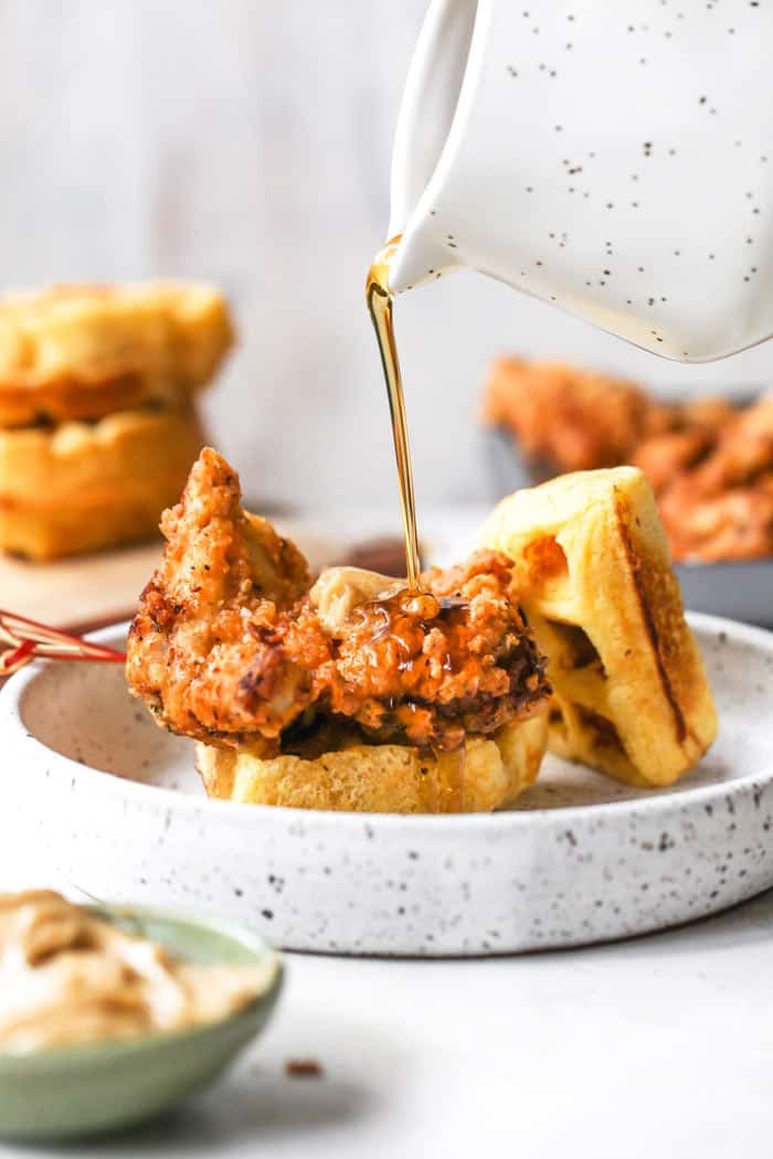 Close-up shot of delicious Chicken and Waffle Sliders, with crispy chicken, fluffy waffles, and drizzled maple syrup